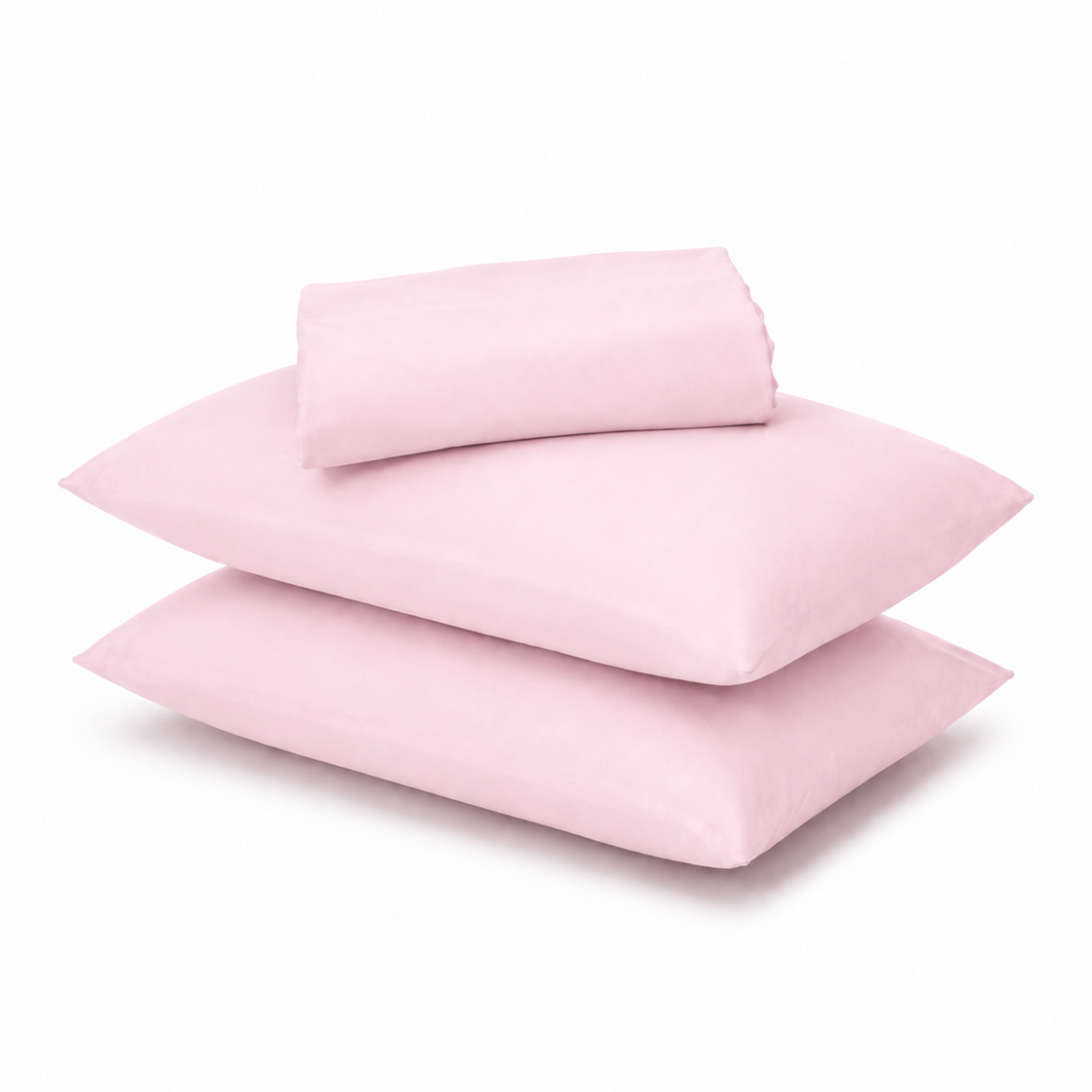 A stack of three light pink pillowcases with a matching folded sheet or pillowcase on top, photographed on a clean white background.