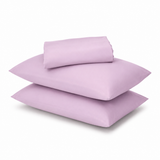 A stack of three light purple pillowcases on a clean white background.