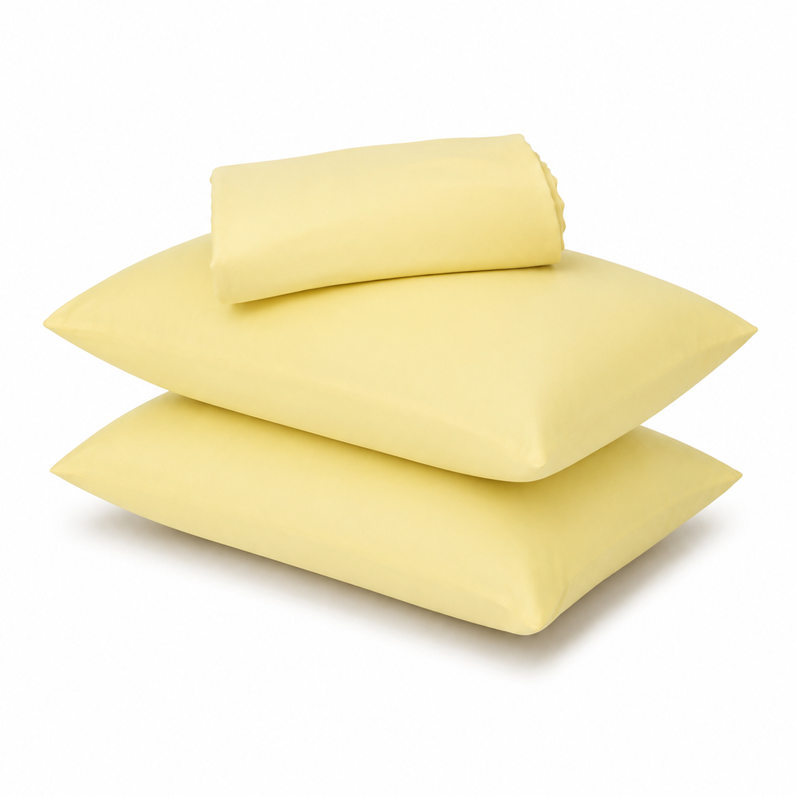 Three light yellow pillows, including two flat square pillows and one rolled pillowcase, stacked on a white background.
